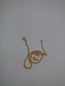 Elegant Gold Beaded Bracelet with Charm
