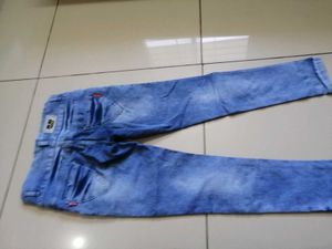 Distressed Blue Denim Jeans