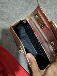 purse in rose Golden colour.