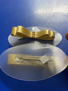 Ribbon How Hair Clip In Golden Colour