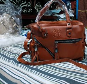 Stylish Tan Leather Handbag with Tassel Detail