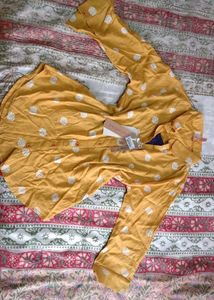 Yellow top with white polka dots