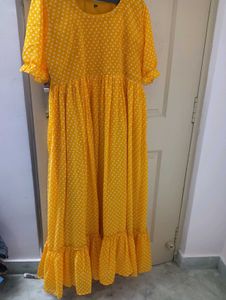 yellow long frockwith white dots
