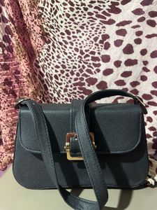 Chic Black Crossbody Bag with Gold Buckle