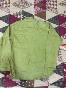 Combo of green shirt and denim jeans