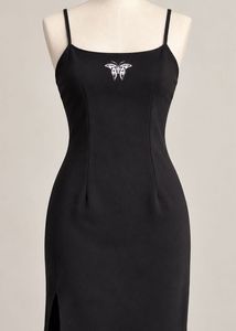 Chic Black Mini Dress with Butterfly Detail