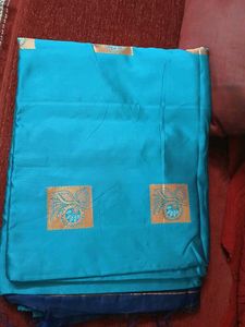 Beautiful Teal Saree with Gold Accents