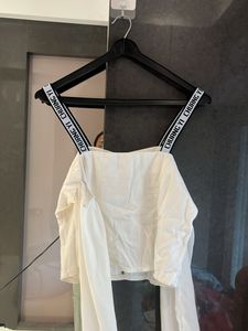 Chic White Button-Up Blouse with Logo Straps