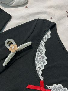 Chic Black Long Sleeve Top with Red Bows
