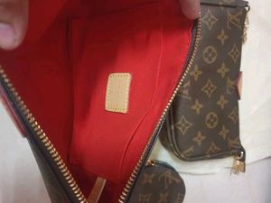 Louis Vuitton pochette With Pink Belt