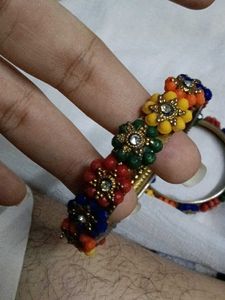 Vibrant Beaded Bangles with Flower Embellishments