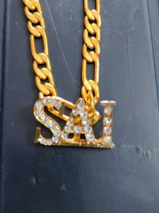 Gold Plated chain with locketof  Name  "SAI"