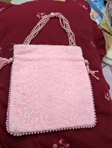 pink embroiderd party  potli bag absolutely new