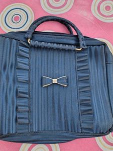 Stylish Blue Handbag with Bow Accent