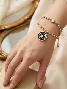 Elegant Gold Beaded Bracelet with Charm