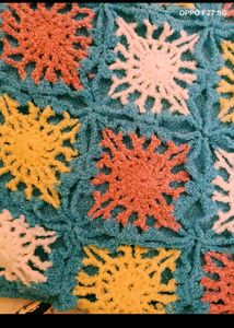 27. Crocheted Granny Square Sweater