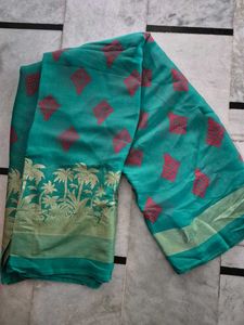 Beautiful Teal Saree with Pink Motifs