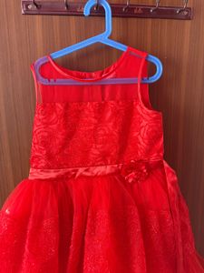 Red vibrant and elegant girls’ party dress