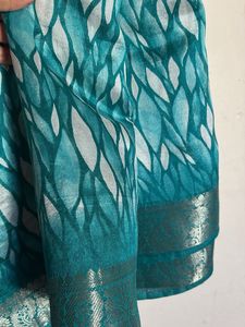 Elegant Teal Saree with Intricate Border