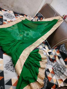 Elegant Emerald Green Saree with Gold Border