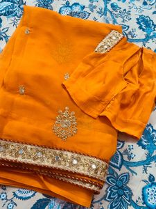 Exquisite Orange Saree with Embellishments