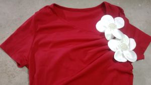 Chic Red Top with Floral Accent