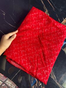 Vibrant Red Saree with Intricate Silver Weave