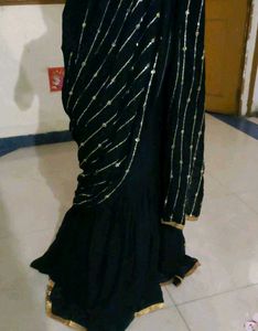 Elegant Black Saree with Golden Embellishments