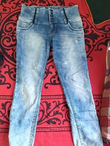 39.Distressed High-Waisted Blue Jeans