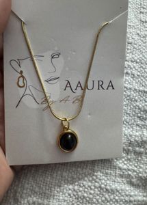Elegant Gold Necklace with Black Stone
