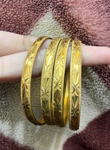 Gold-toned Bangle Set (4) 2-4