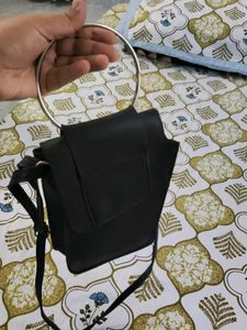 Stylish Black Crossbody Bag with Ring Detail