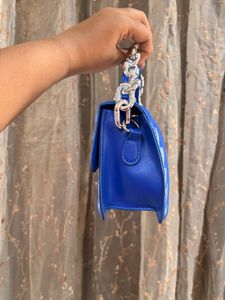 Blue sling purse