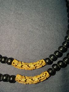 Black beads and golden finish costume jewellery