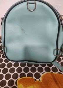 Cute Teal Crossbody Bag with Charm and keychain.