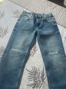 Distressed Blue Denim Jeans
