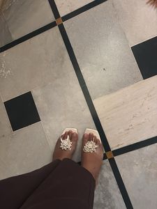 Chic White Flat Sandals with Embellishments
