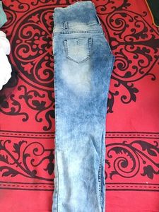 39.Distressed High-Waisted Blue Jeans