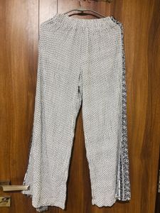 white top with black trousers