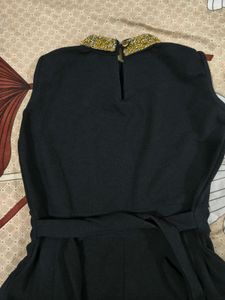 Elegant Black Dress with Embellished Neckline