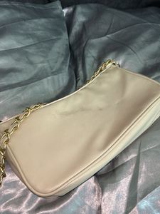 Elegant Cream Handbag with Gold Chain