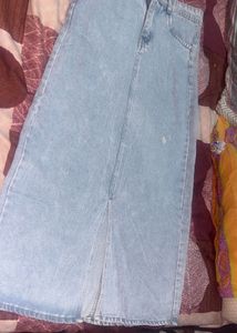 This is a light-wash denim midi skirt