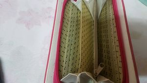 A beautiful pink and golden wallet