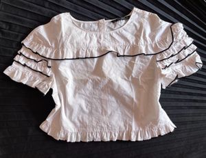 Chic White Ruffle Top with Black Trim