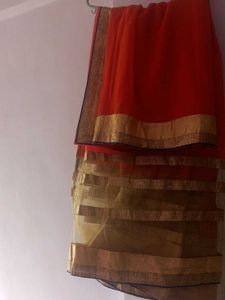 Elegant Orange Saree with Golden Border