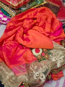 Vibrant Orange Saree with Intricate Embroidery