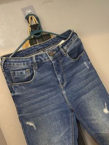 Distressed Blue Denim Jeans