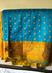 Stunning Teal Saree with Gold Accents