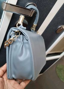 Stylish Light Blue Handbag with Gold Chain