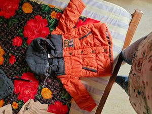 Orange Puffer Jacket with Grey Hood